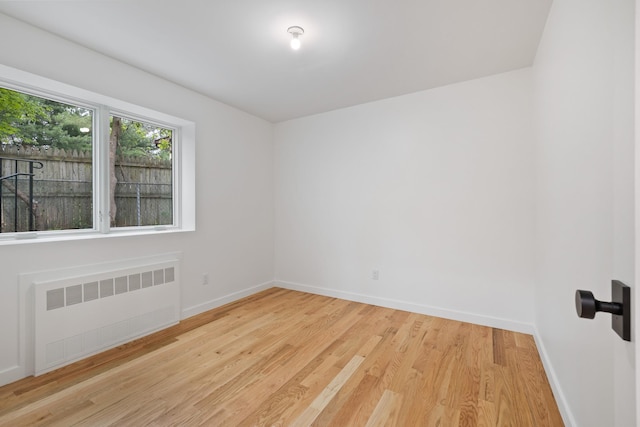 15 Gilda Ct, Spring Valley, NY 10977 - unfurnished room featuring radiator and wood finished floors