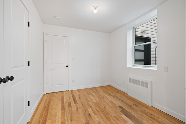 15 Gilda Ct, Spring Valley, NY 10977 - spare room with radiator heating unit, light wood finished floors, and a smoke detector