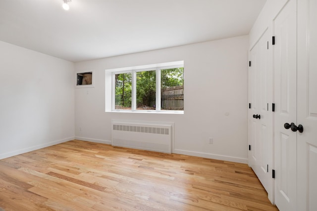 15 Gilda Ct, Spring Valley, NY 10977 - unfurnished room featuring radiator and light wood finished floors