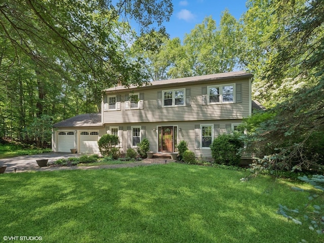 10 Silvermine Dr, South Salem, NY 10590 - colonial house featuring a front yard, an attached garage, and concrete driveway