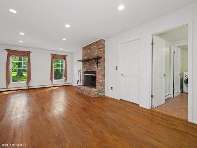 10 Silvermine Dr, South Salem, NY 10590 - unfurnished living room featuring wood finished floors, washer / clothes dryer, a fireplace, recessed lighting, and baseboard heating