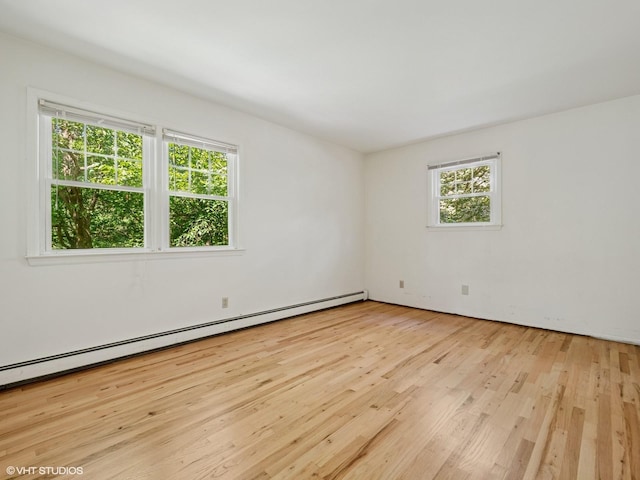 10 Silvermine Dr, South Salem, NY 10590 - spare room with a baseboard heating unit and light wood finished floors