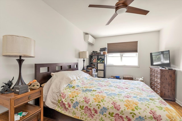 69-28 43rd Ave, Woodside, NY 11377 - bedroom featuring an AC wall unit, wood finished floors, and ceiling fan