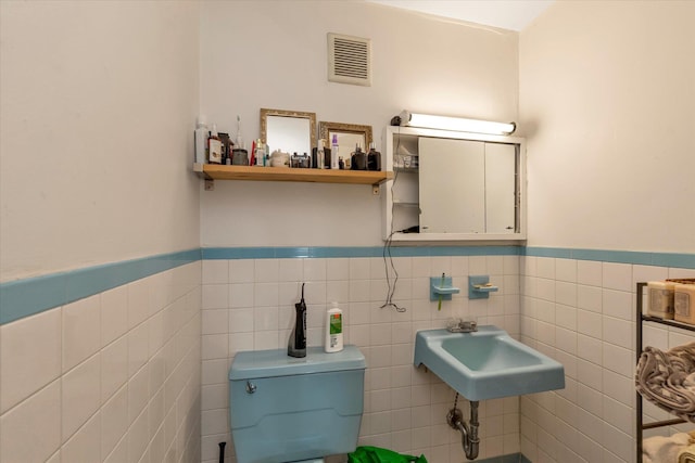 69-28 43rd Ave, Woodside, NY 11377 - half bath with tile walls and wainscoting