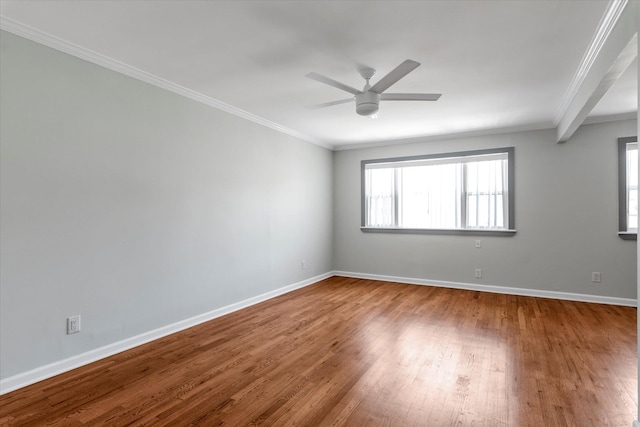 69-28 43rd Ave, Woodside, NY 11377 - empty room featuring plenty of natural light, wood finished floors, a ceiling fan, and crown molding