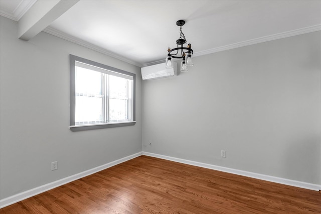 69-28 43rd Ave, Woodside, NY 11377 - spare room with a chandelier, ornamental molding, and wood finished floors