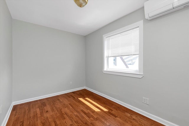 69-28 43rd Ave, Woodside, NY 11377 - unfurnished room with an AC wall unit and wood finished floors