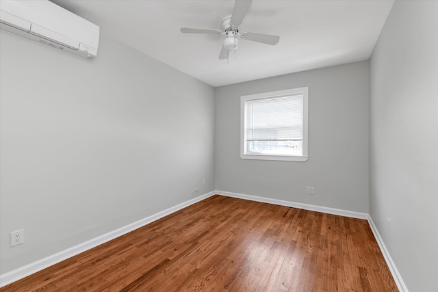 69-28 43rd Ave, Woodside, NY 11377 - spare room featuring a wall mounted AC, wood finished floors, and ceiling fan
