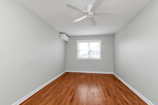 69-28 43rd Ave, Woodside, NY 11377 - empty room with a wall mounted AC, wood finished floors, and a ceiling fan