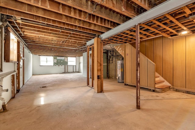 69-28 43rd Ave, Woodside, NY 11377 - below grade area featuring gas water heater and stairs