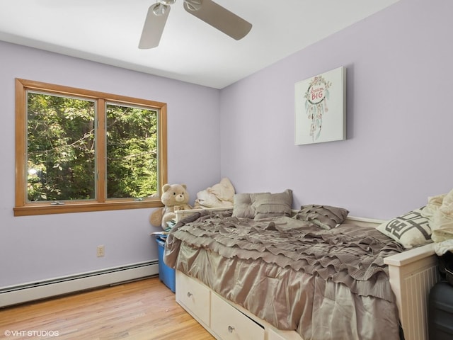 212 Elmwood Rd, South Salem, NY 10590 - bedroom featuring a baseboard radiator, wood finished floors, and ceiling fan