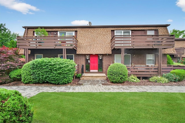 160 New Holland Vlg, Nanuet, NY 10954 - view of front of house with a balcony, brick siding, and a front lawn