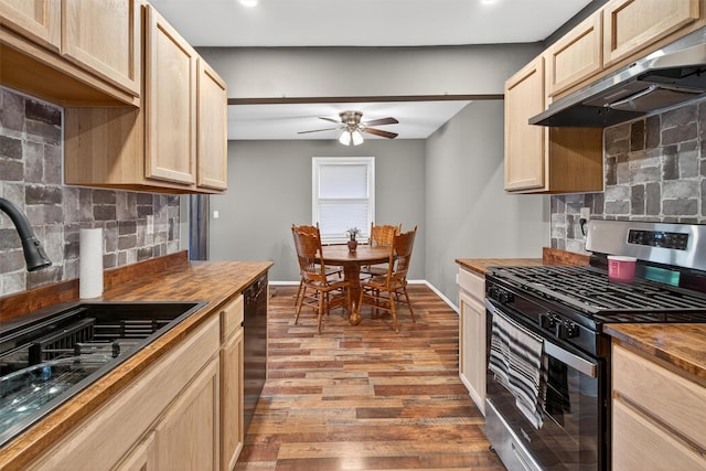 160 New Holland Vlg, Nanuet, NY 10954 - kitchen with stainless steel gas range oven, under cabinet range hood, butcher block countertops, a ceiling fan, and recessed lighting