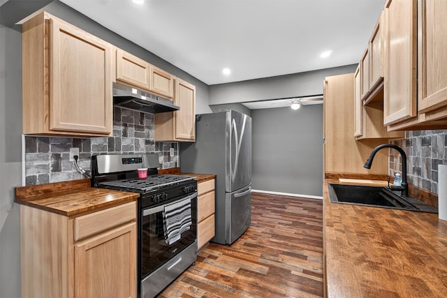 160 New Holland Vlg, Nanuet, NY 10954 - kitchen with stainless steel appliances, wooden counters, under cabinet range hood, light brown cabinets, and dark wood-style flooring