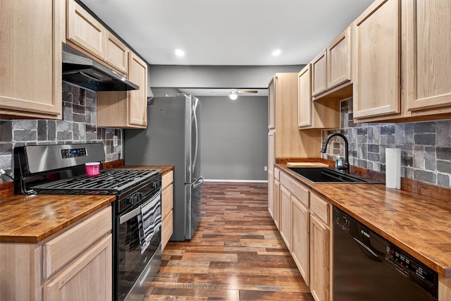 160 New Holland Vlg, Nanuet, NY 10954 - kitchen featuring wood counters, gas stove, dishwasher, under cabinet range hood, and dark wood-style flooring