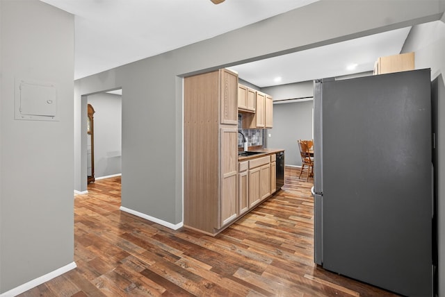 160 New Holland Vlg, Nanuet, NY 10954 - kitchen with freestanding refrigerator, light brown cabinetry, dark wood-type flooring, black dishwasher, and backsplash