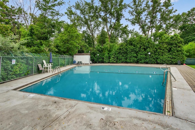 160 New Holland Vlg, Nanuet, NY 10954 - community pool with a storage unit, view of scattered trees, and a patio