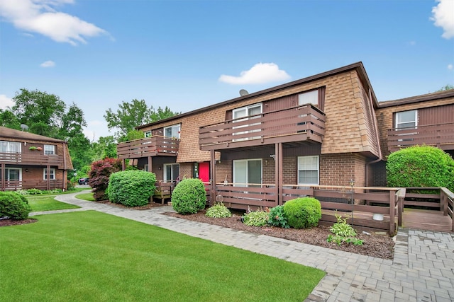 160 New Holland Vlg, Nanuet, NY 10954 - view of front of property with a balcony, brick siding, and a front yard