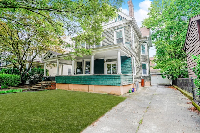 335 E 18th St, Brooklyn, NY 11226 - victorian home featuring covered porch, a garage, concrete driveway, and a chimney