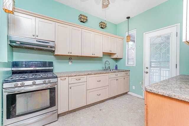 335 E 18th St, Brooklyn, NY 11226 - kitchen featuring stainless steel range with gas stovetop, extractor fan, hanging light fixtures, and ceiling fan