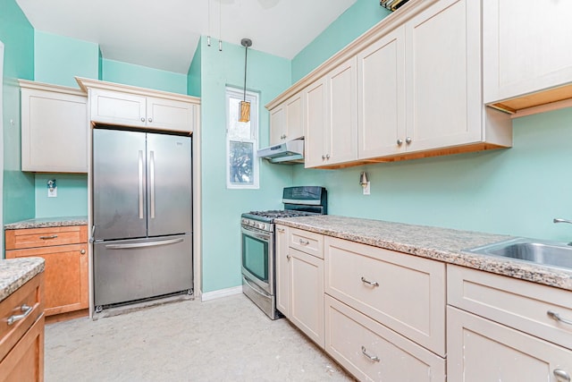 335 E 18th St, Brooklyn, NY 11226 - kitchen with appliances with stainless steel finishes, under cabinet range hood, hanging light fixtures, and light flooring