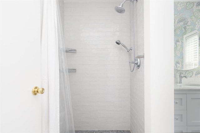 43 Washington Ave, Greenport, NY 11944 - bathroom featuring a tile shower and vanity