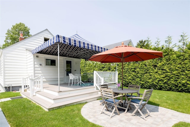43 Washington Ave, Greenport, NY 11944 - view of patio / terrace featuring a wooden deck and outdoor dining area