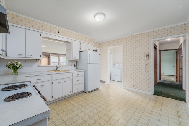 3000 Pequash Ave, Cutchogue, NY 11935 - kitchen with washer / clothes dryer, white appliances, wallpapered walls, light countertops, and ornamental molding