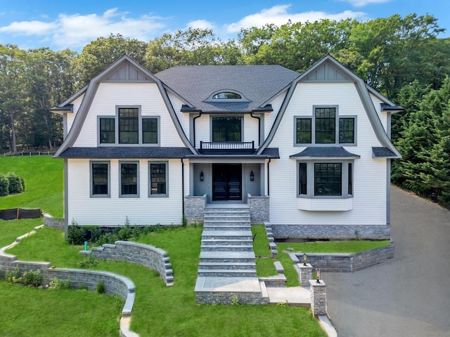 589 Old Bridge Rd, Northport, NY 11768 - view of front of property featuring a gambrel roof, stairway, a front yard, and a balcony