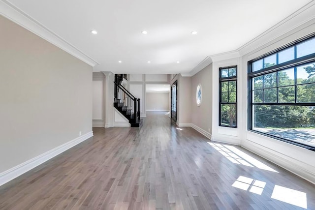 589 Old Bridge Rd, Northport, NY 11768 - unfurnished living room featuring crown molding, stairway, wood finished floors, and recessed lighting