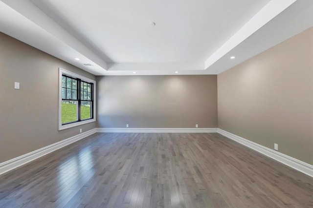 589 Old Bridge Rd, Northport, NY 11768 - unfurnished room featuring a raised ceiling, wood finished floors, and recessed lighting