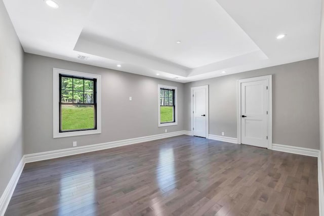 589 Old Bridge Rd, Northport, NY 11768 - spare room featuring a raised ceiling, wood finished floors, and recessed lighting