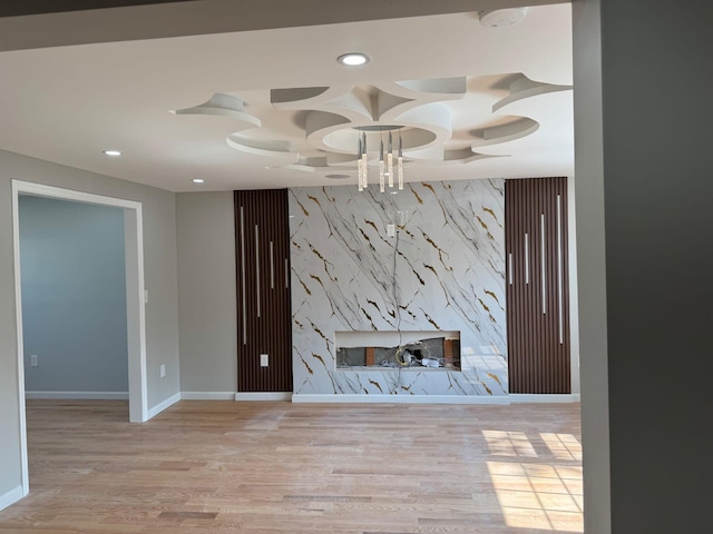 4642 Murdock Ave, Bronx, NY 10466 - unfurnished living room featuring an accent wall, recessed lighting, and wood finished floors