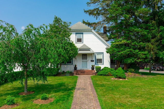 53 Community Rd, Bay Shore, NY 11706 - view of front of property with a front yard and a chimney