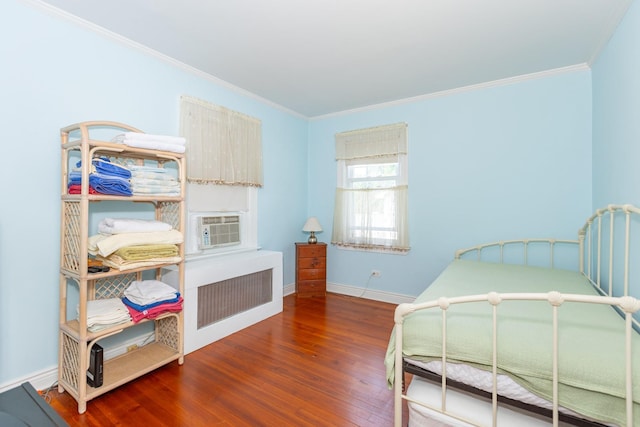 53 Community Rd, Bay Shore, NY 11706 - bedroom with wood finished floors, ornamental molding, radiator, and cooling unit