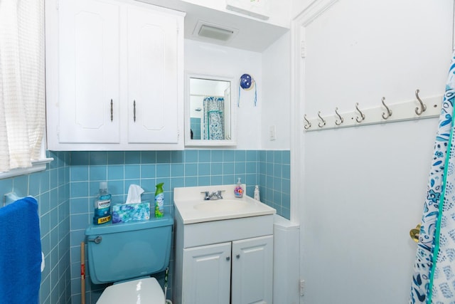 53 Community Rd, Bay Shore, NY 11706 - full bathroom with vanity, tile walls, a wainscoted wall, and curtained shower