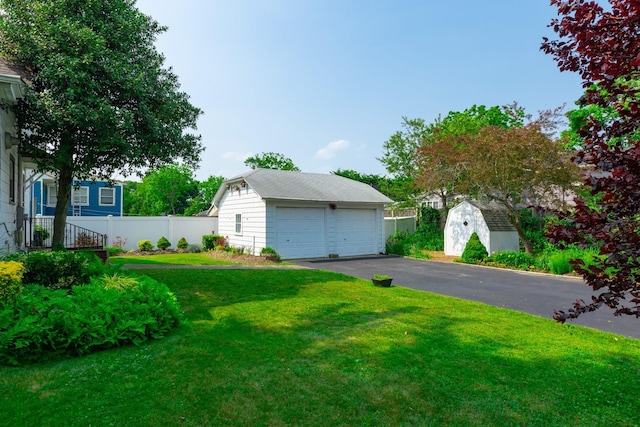 53 Community Rd, Bay Shore, NY 11706 - view of yard with a detached garage and a shed