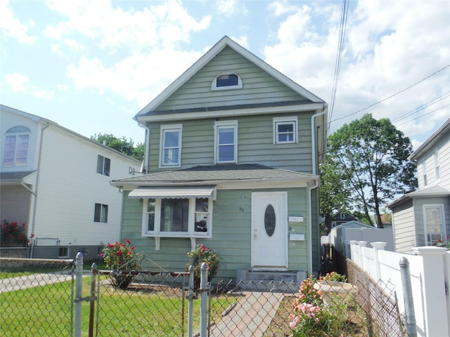 33 Thorne Ave, Hempstead, NY 11550 - view of front of home with a fenced front yard and a gate