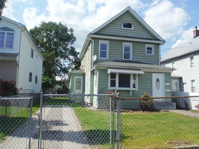 33 Thorne Ave, Hempstead, NY 11550 - view of front of home with a gate