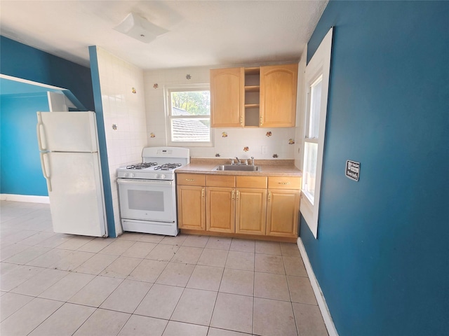 33 Thorne Ave, Hempstead, NY 11550 - kitchen with white appliances, light brown cabinetry, light countertops, light tile patterned flooring, and open shelves