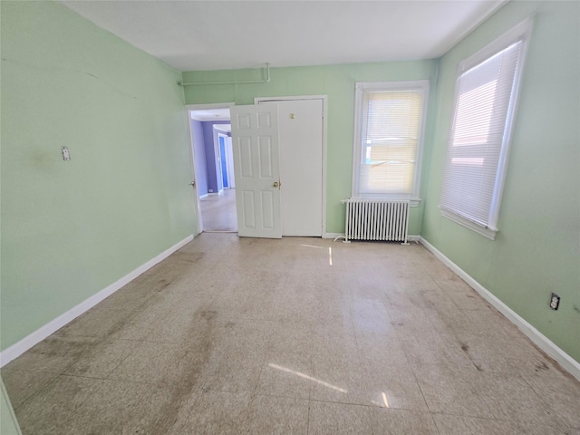 33 Thorne Ave, Hempstead, NY 11550 - unfurnished room with radiator heating unit and baseboards