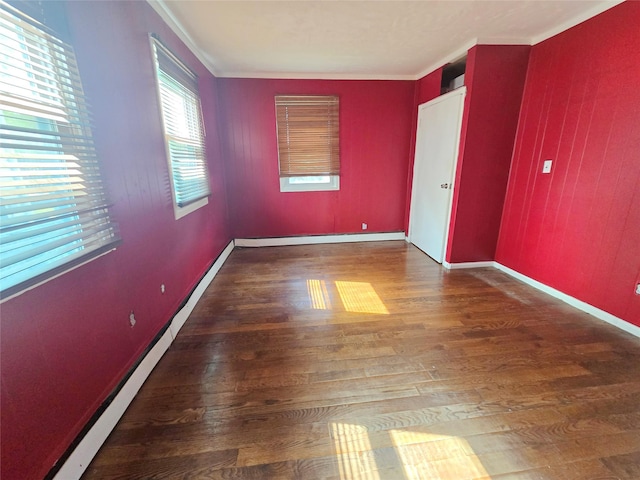 33 Thorne Ave, Hempstead, NY 11550 - unfurnished bedroom with wood finished floors, crown molding, and a baseboard heating unit