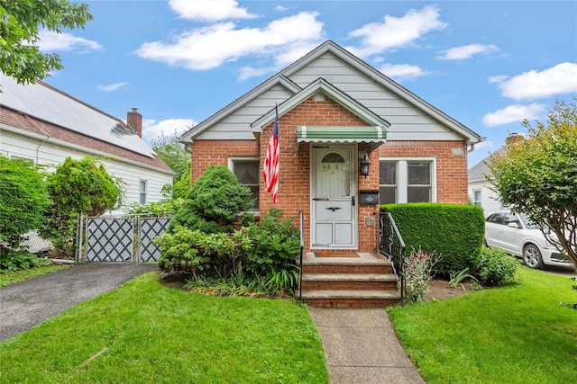 48-67 187th St, Fresh Meadows, NY 11365 - view of front of house with brick siding and driveway