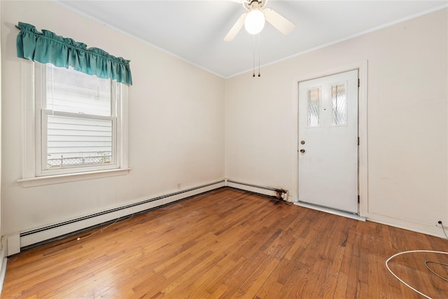 48-67 187th St, Fresh Meadows, NY 11365 - empty room featuring ornamental molding, wood finished floors, a ceiling fan, and a baseboard heating unit