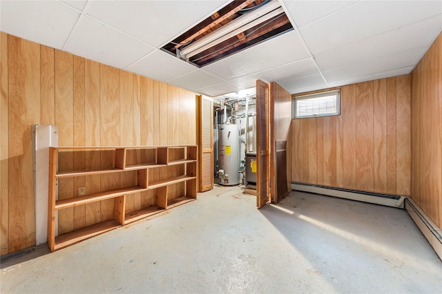 48-67 187th St, Fresh Meadows, NY 11365 - basement featuring water heater, wood walls, and baseboard heating