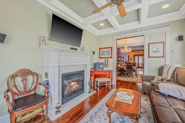 33 S Bay Ave, Amityville, NY 11701 - living area with crown molding, a high end fireplace, wood finished floors, beam ceiling, and coffered ceiling
