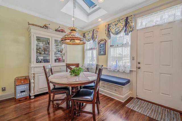 33 S Bay Ave, Amityville, NY 11701 - dining room with a skylight, crown molding, and dark wood-style flooring