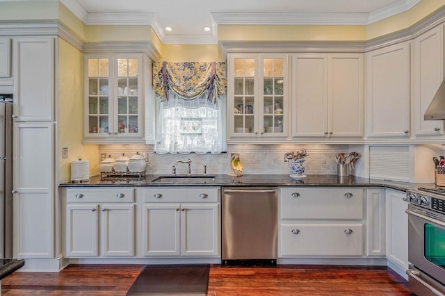 33 S Bay Ave, Amityville, NY 11701 - kitchen with stainless steel appliances, backsplash, white cabinetry, ornamental molding, and recessed lighting