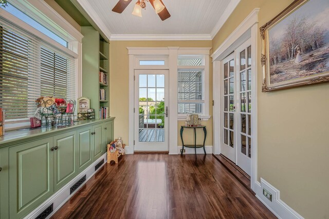 33 S Bay Ave, Amityville, NY 11701 - entryway with ornamental molding, ceiling fan, dark wood-type flooring, and plenty of natural light
