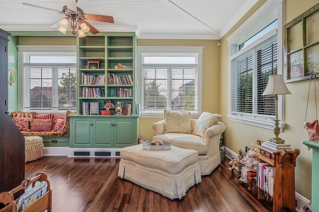33 S Bay Ave, Amityville, NY 11701 - sitting room with dark wood-style flooring, crown molding, and a ceiling fan